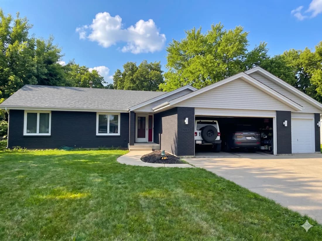Painted-brick ranch — modern charcoal body with bright trim